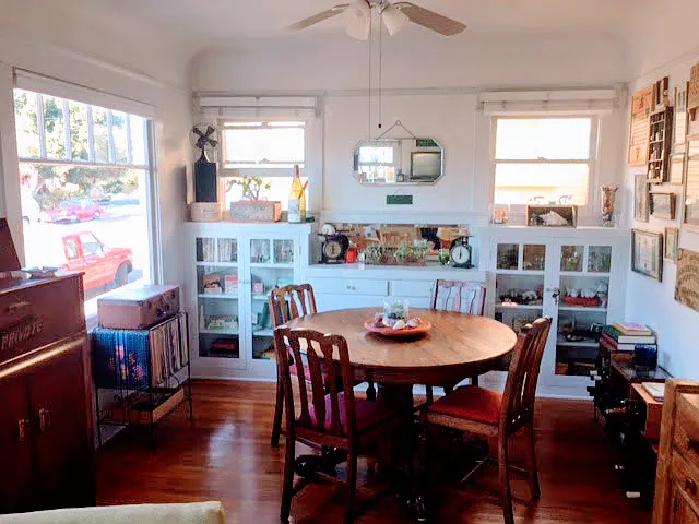 Front family room with bright windows on 3 of the walls & built in cabinets