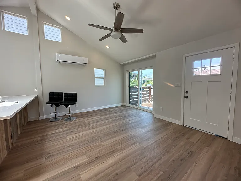 Living room slider connects the inside to the outside for seamless living and relaxing. AC and heater provided by mini-split system in living room.
