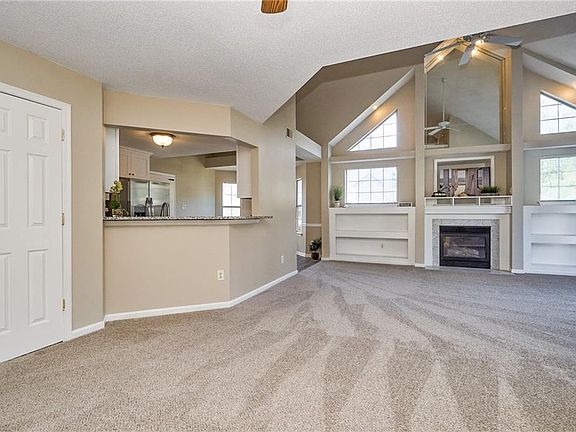 Open floorplan with cathedral ceilings greets you upon entrance with an abundance of natural light.