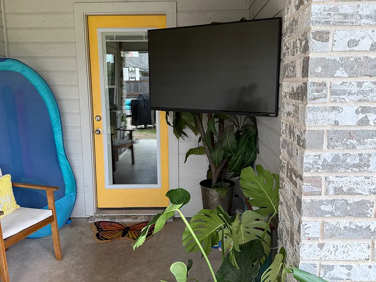 back patio has cover, tv and ceiling fan for those nice evenings.