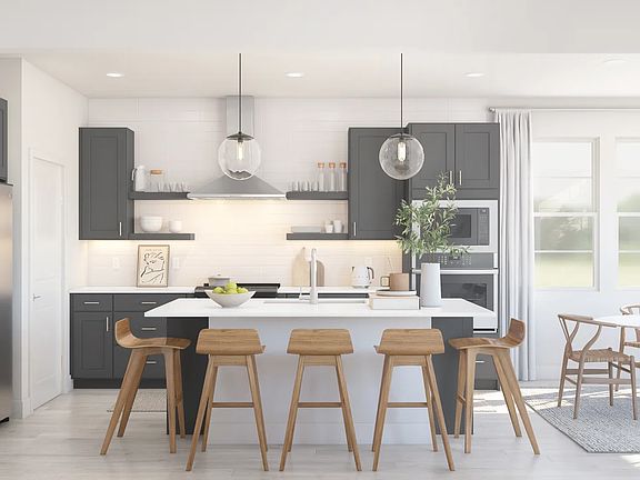 Kitchen with floating shelves and pendant lighting