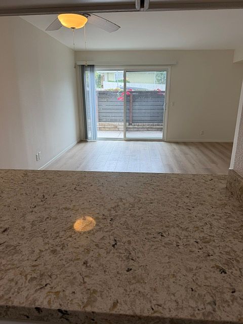 Looking out from the kitchen to the living room and patio