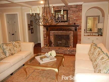 Formal Living Room
						:
						Featuring a fireplace.