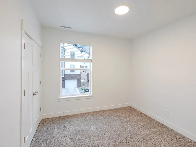 Second bedroom with closet with french doors