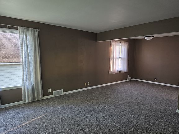 Carpeted dining room attached to living room. Brand new carpet!