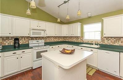 Huge Kitchen with ample cabinetry.  Appliances remain with the home.