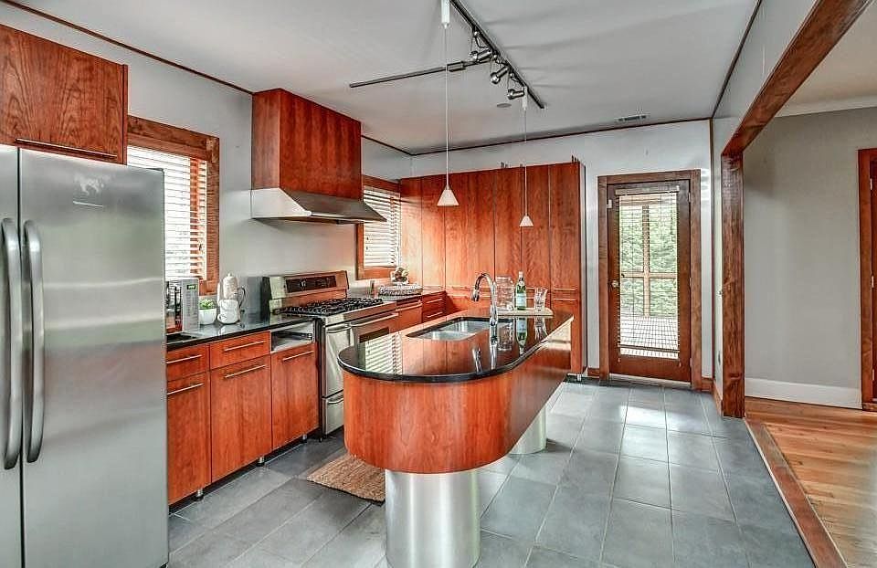 Custom-Built Chef's Kitchen with access to Screened-In Patio