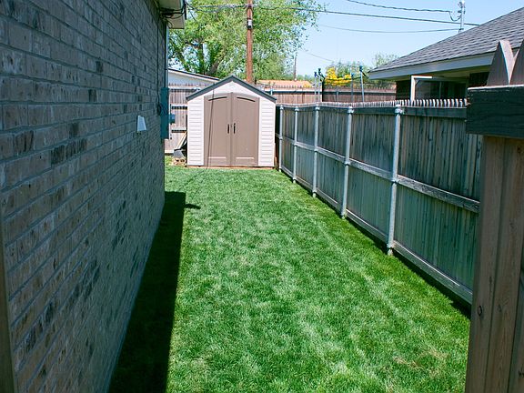 Looking through side gate to back yard