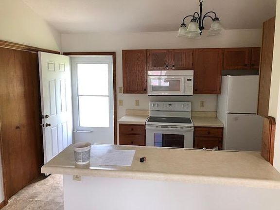 Back door has screen door with window. - sample pic