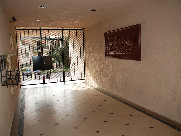 Casa de la Reina welcoming exterior covered lobby with mail boxes
