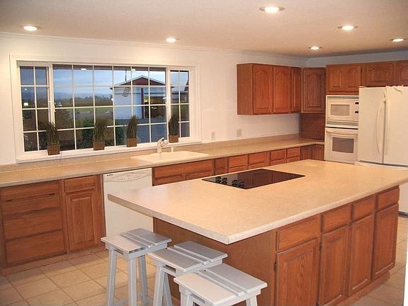 Pretty kitchen looks out to yard and Mount Rainier