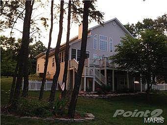 Beautiful views of the lake are visible from the large deck, sha
