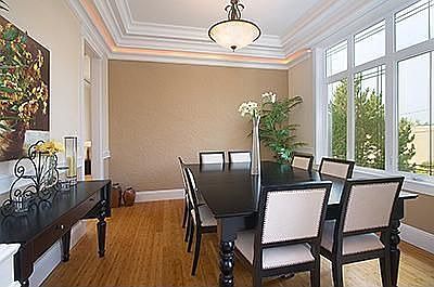formal dining room with dramatic molding and rope lightening