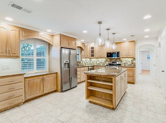 Open kitchen with abundant cabinet space.