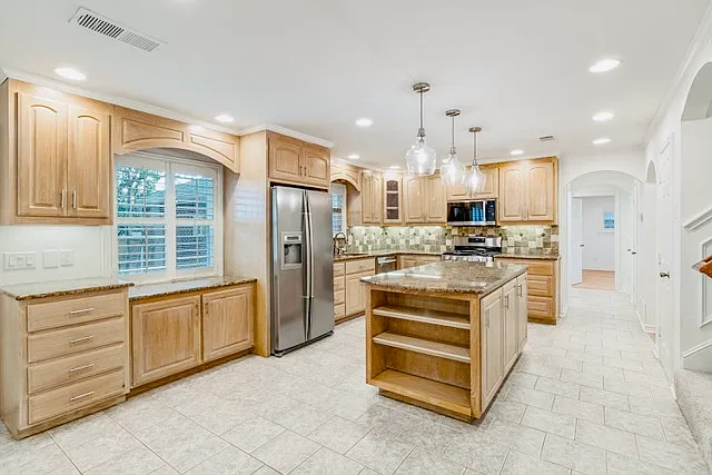 Open kitchen with abundant cabinet space.