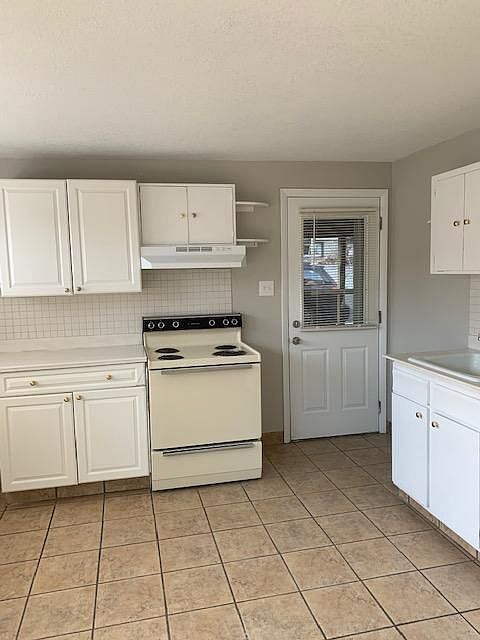 Door opens directly into the carport.
