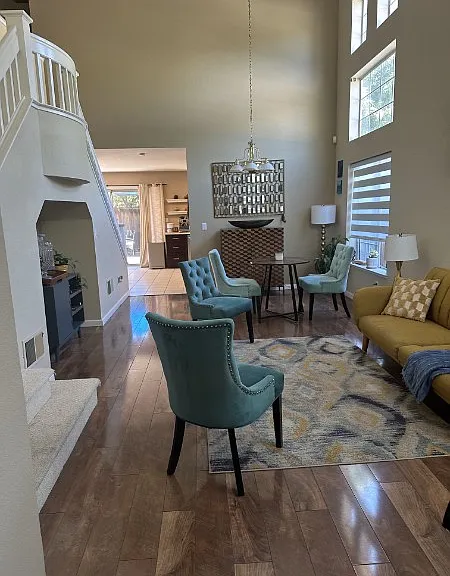 Large living room with high ceiling, wooden flooring in the living, family rooms and the bedrooms.