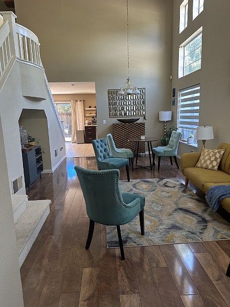 Large living room with high ceiling, wooden flooring in the living, family rooms and the bedrooms.