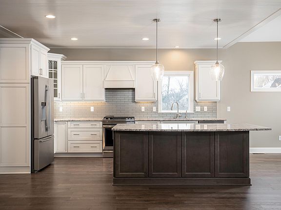 Kitchen with granite counters and island