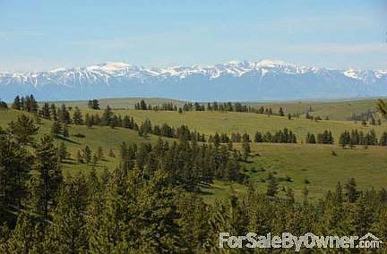 Beartooth Views
						:
						The Beartooth Mountains on a clear spring day.