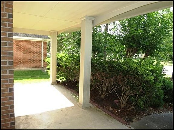 UPGRADED FRONT PORCH WITH BEAUTIFUL LANDSCAPING TO GIVE YOU PRIVACY.