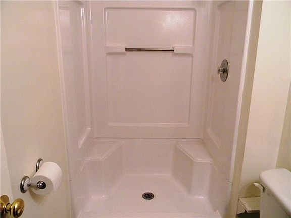 Large shower in bathroom.