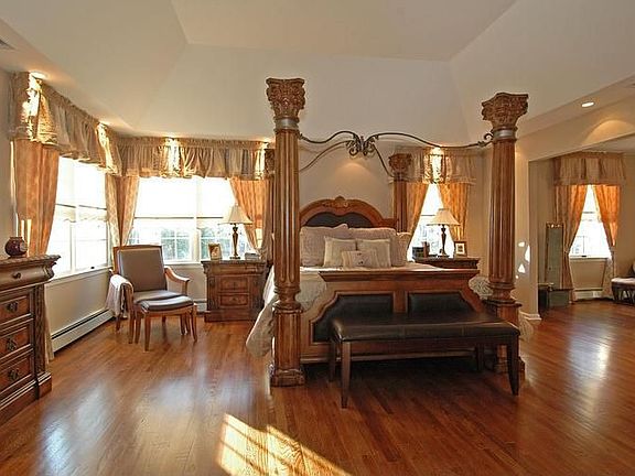 Sumptuous Master Bedroom offers large sitting room, vanity, 2 w/i closets...