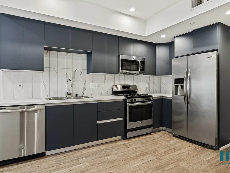 Kitchen with Stainless-Steel Refrigerator, Stove, Microwave Oven, and Dishwasher