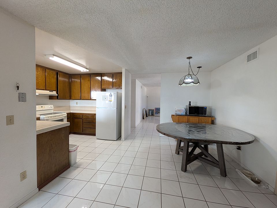 Dining and Kitchen area sit in between a formal living room, and separate family room area