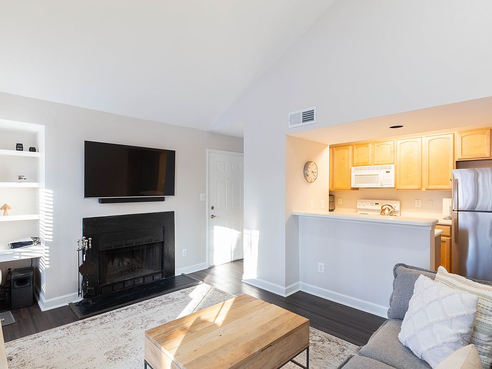 Vaulted Ceilings, wood burning fireplace, LVP Flooring. Natural Light.