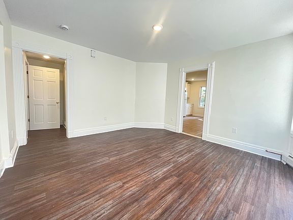 Living room- showing front door entrance and kitchen entrance