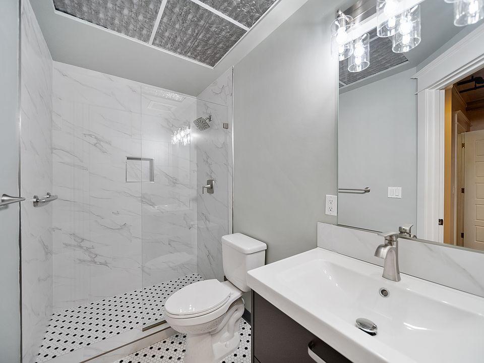 Newly Remodeled Bathroom with Glass Walk-in Shower