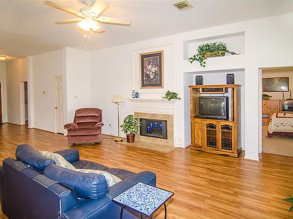 This family room offers room for the media center, as well as offering the comfort of a wood burning fireplace.