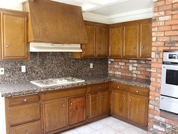 Large open kitchen with plenty of counter space. Gas stove top.