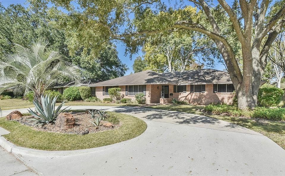 8902 Railton greets you with mature landscaping & the classic beauty of brick.