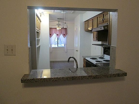 View of the GRANITE Counter Kitchen From the Breakfast Bar. Great Access to the Formal Dining Area.