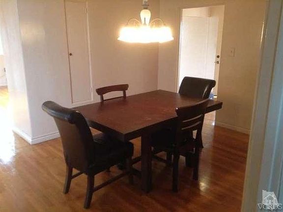 Spacious Dining room with gleaming hardwood floors.