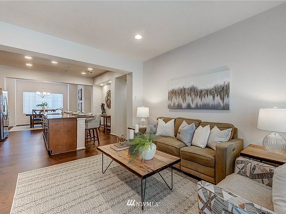 Living room flows seamlessly with kitchen and dining room