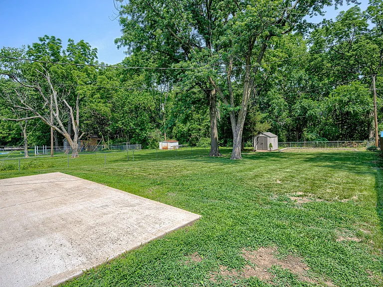 Backyard near side fence and sliding glass patio doors from dining area