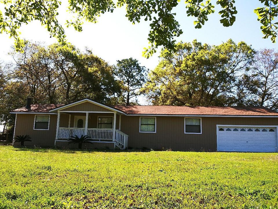 Cute 3/2 Ranch style home, front deck, 2 car garage