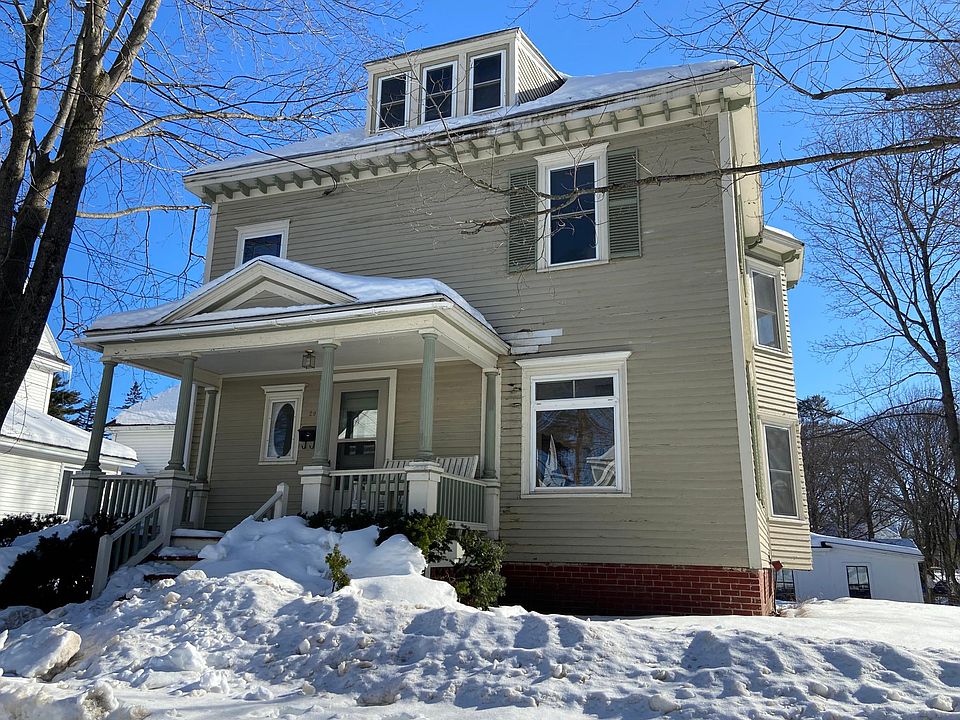 front of house with front porch (and two rockers)