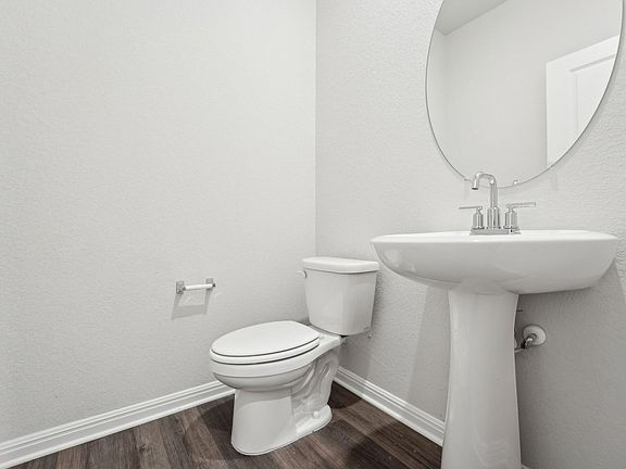 The powder bathroom on the first floor is convenient for guests.