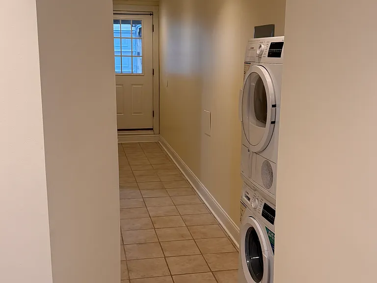 Hallway with washer and dryer