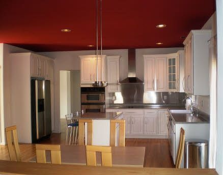 Kitchen with all stainless steel appliances and backsplash