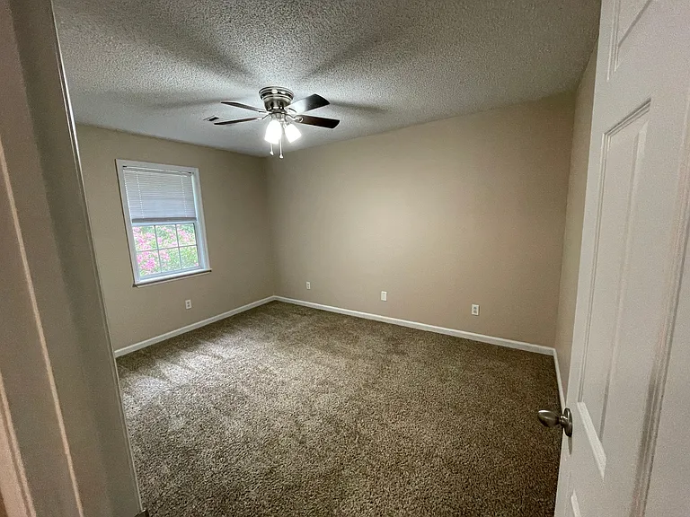 Continue to the end of the hallway to bedroom 3