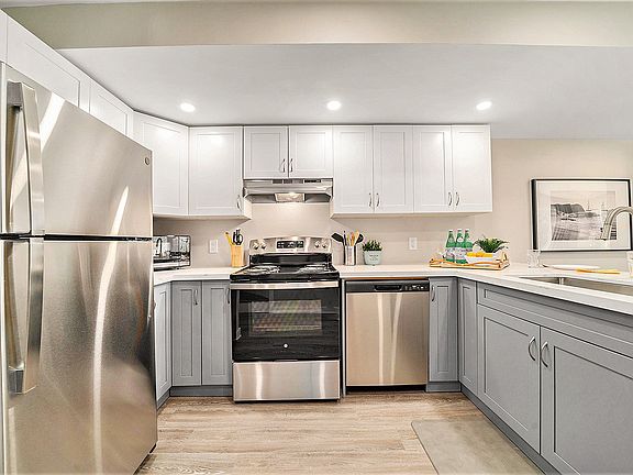Fully equipped kitchen with stainless steel appliances, perfect for long-term stays in our Ottawa furnished rental.