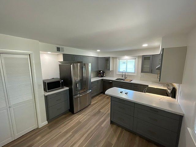 Updated kitchen with modern finishes and ample cabinet space