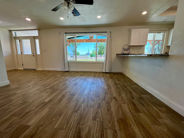 Main living area with large open dual pane windows