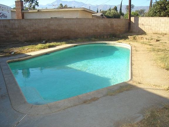 Block Walled Rear Yard with Swimming Pool and Covered Patio