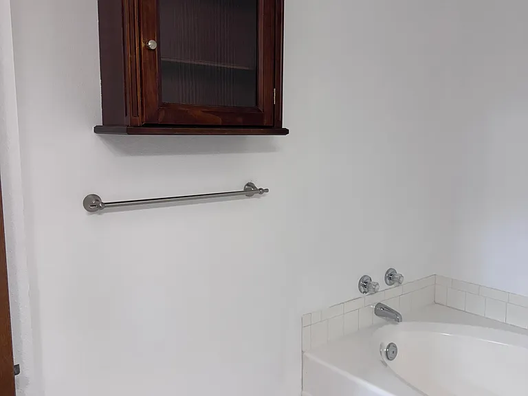 Large bathroom with a garden tub and a separate shower stall.
